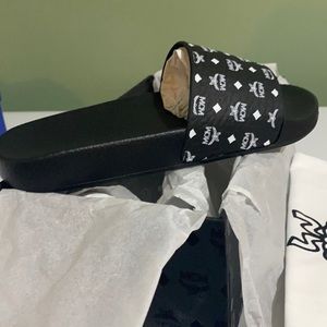 Brand new in box MCM Ram print slide. Never worn